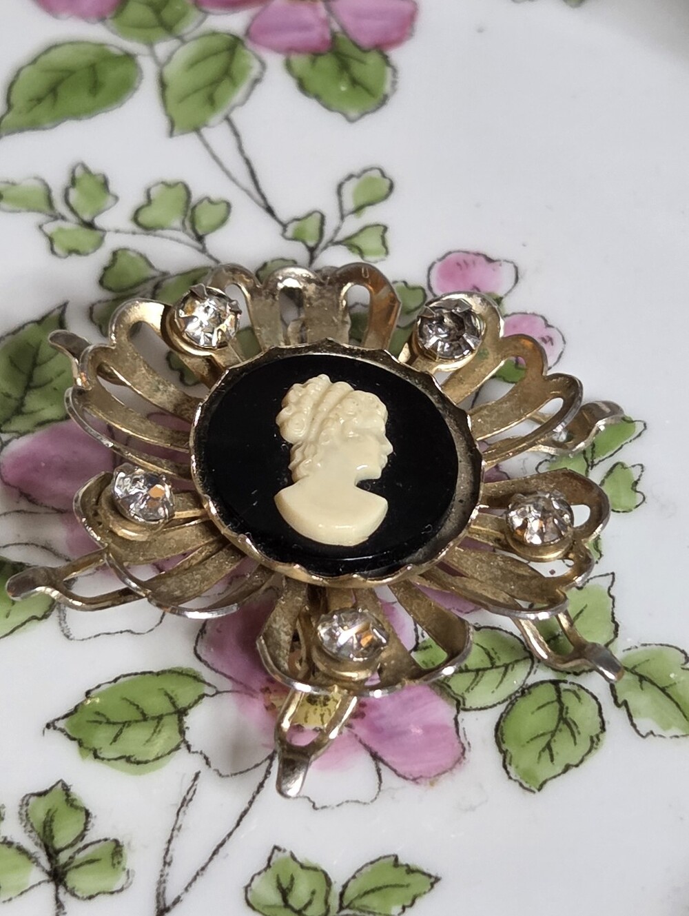 Vintage Black and Cream Cameo Brooch with Rhinestones and Floral Frame